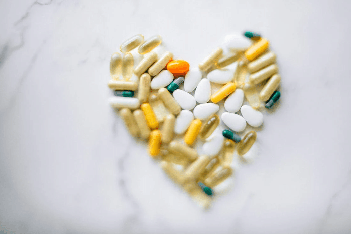 Different pills forming a heart shape